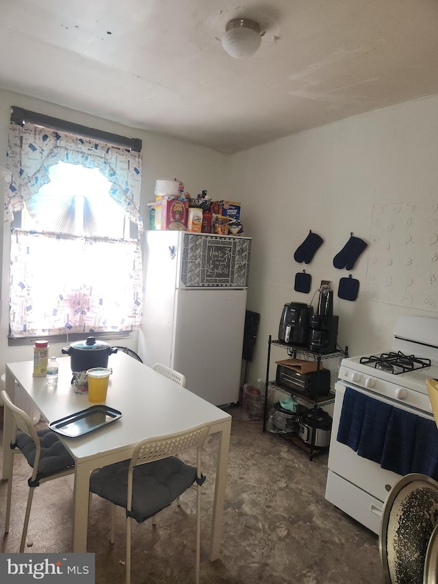 dining room with concrete flooring