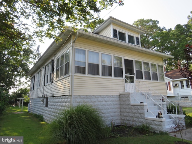 view of front of property with a sunroom