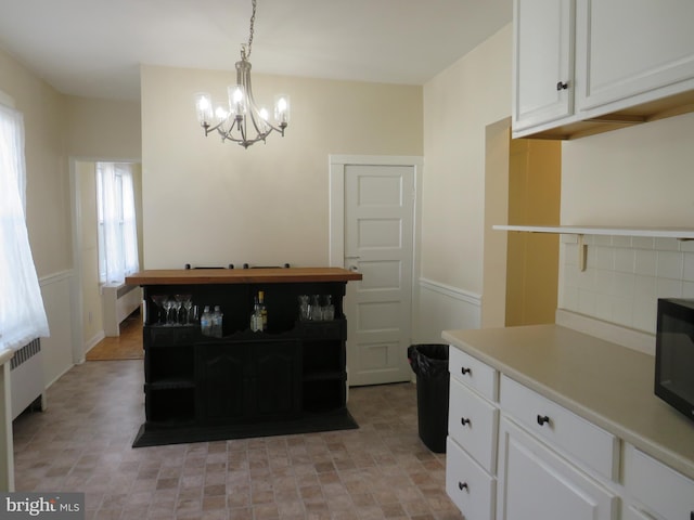 dining room featuring radiator heating unit