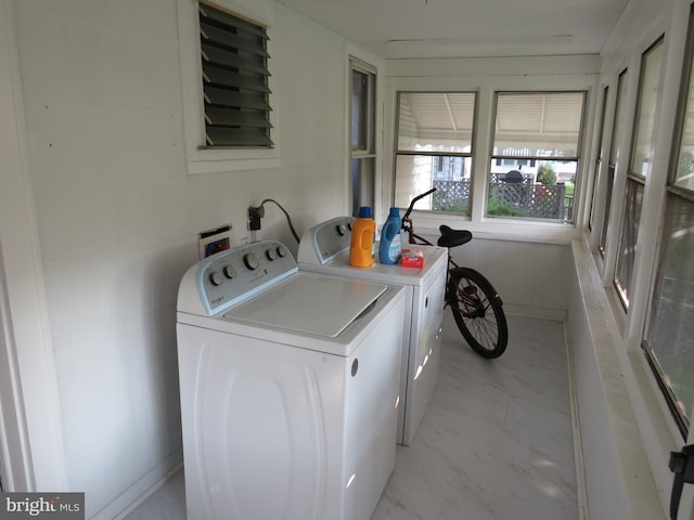 washroom with separate washer and dryer