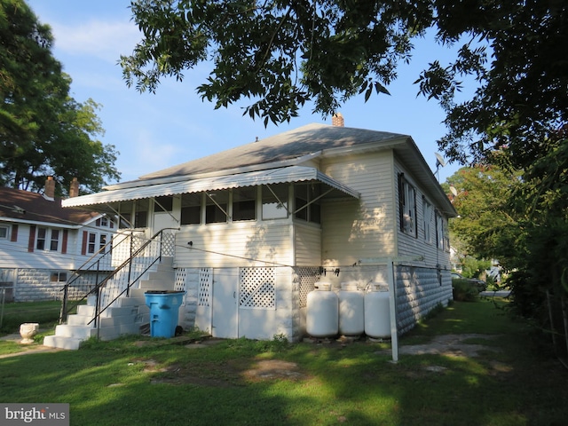 exterior space with a yard