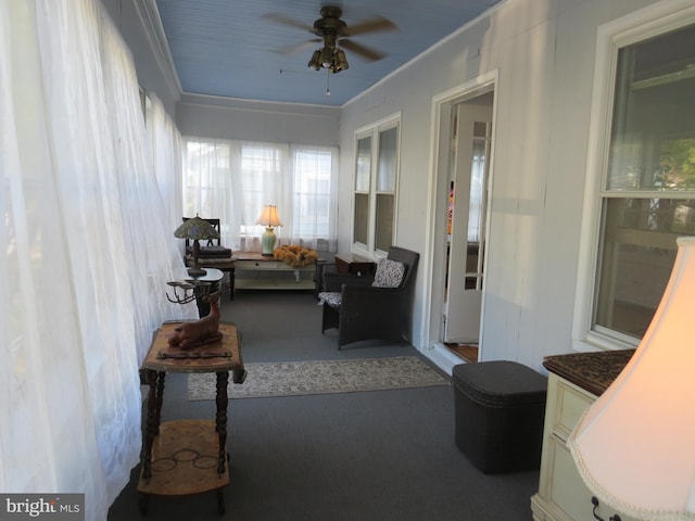 sunroom with ceiling fan