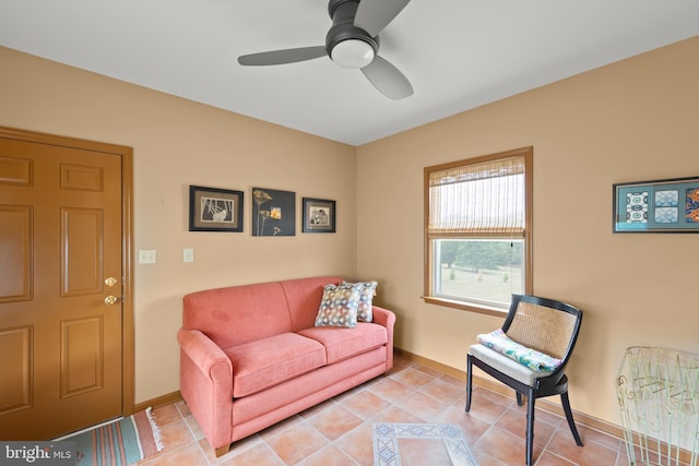 living room with light tile patterned floors and ceiling fan