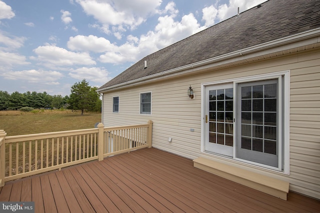 deck featuring a yard