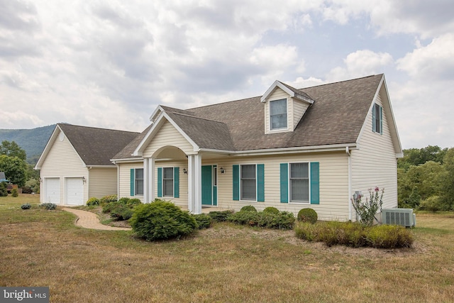 cape cod-style house with a garage, a front yard, and central air condition unit