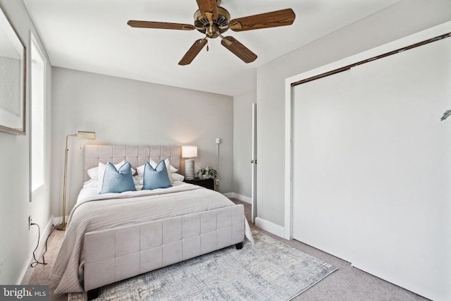 carpeted bedroom featuring ceiling fan