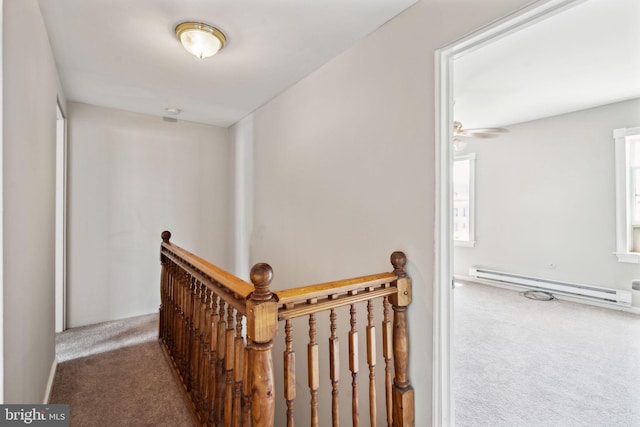 hallway featuring a baseboard radiator and carpet floors