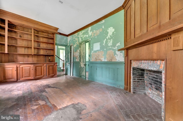 unfurnished living room with ornamental molding