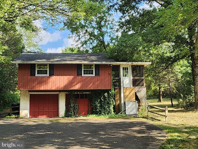 raised ranch featuring a garage