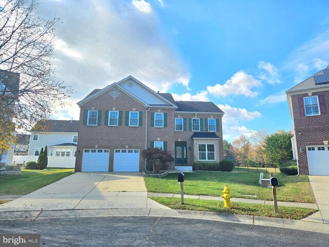 view of front facade featuring a garage and a front yard