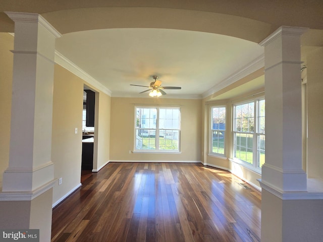 unfurnished living room with ornamental molding, dark hardwood / wood-style floors, ceiling fan, and ornate columns