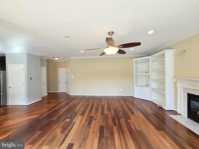 unfurnished living room with dark wood-type flooring, ceiling fan, and ornamental molding