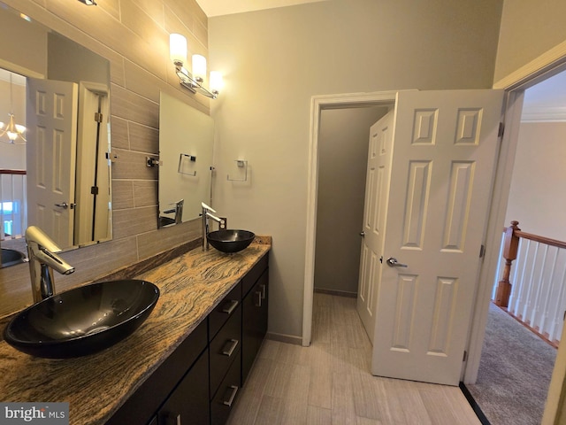 bathroom with hardwood / wood-style flooring and vanity