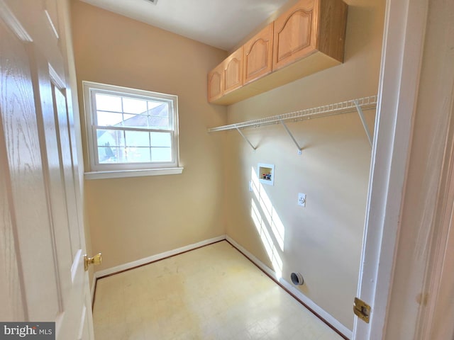 washroom featuring cabinets, hookup for an electric dryer, and hookup for a washing machine