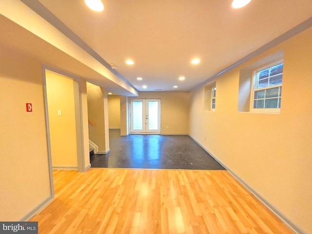 empty room featuring hardwood / wood-style flooring and french doors