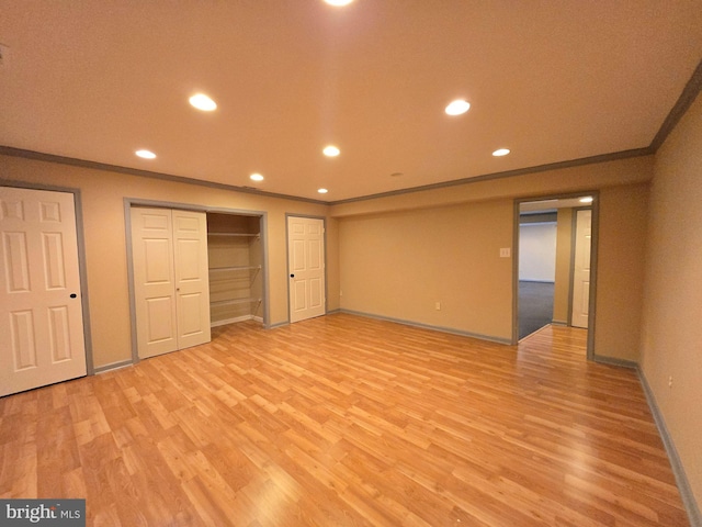 unfurnished bedroom with light hardwood / wood-style flooring and ornamental molding