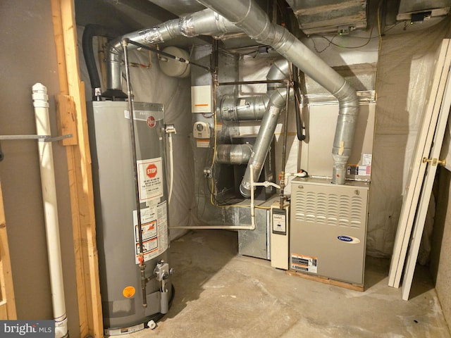 utility room featuring water heater