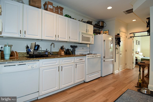 kitchen featuring white appliances, white cabinets, crown molding, light hardwood / wood-style flooring, and sink