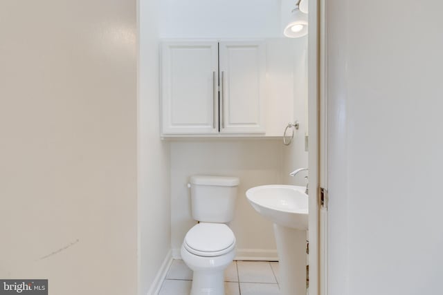 bathroom with tile patterned floors and toilet