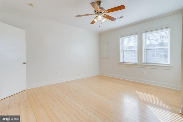 empty room with ceiling fan, ornamental molding, and light hardwood / wood-style flooring