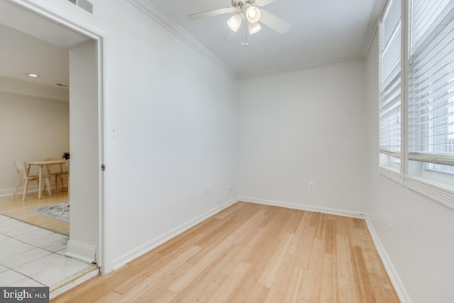 unfurnished room featuring ceiling fan, crown molding, and light hardwood / wood-style flooring