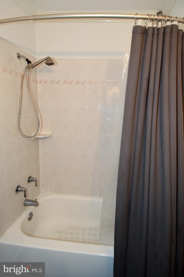 bathroom featuring shower / bath combination with curtain