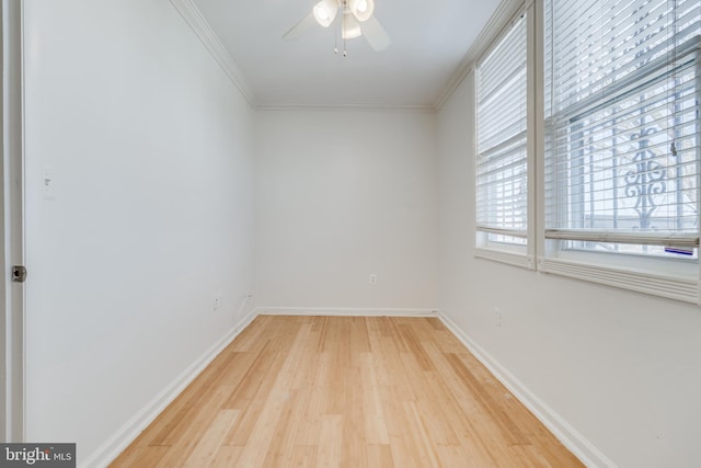 unfurnished room with ceiling fan, crown molding, and light hardwood / wood-style flooring