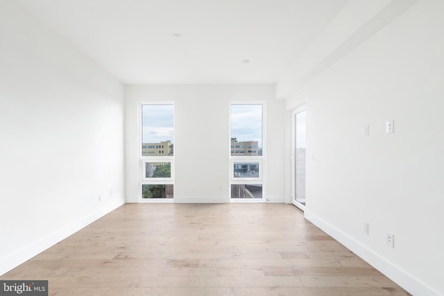 unfurnished living room featuring light wood-type flooring