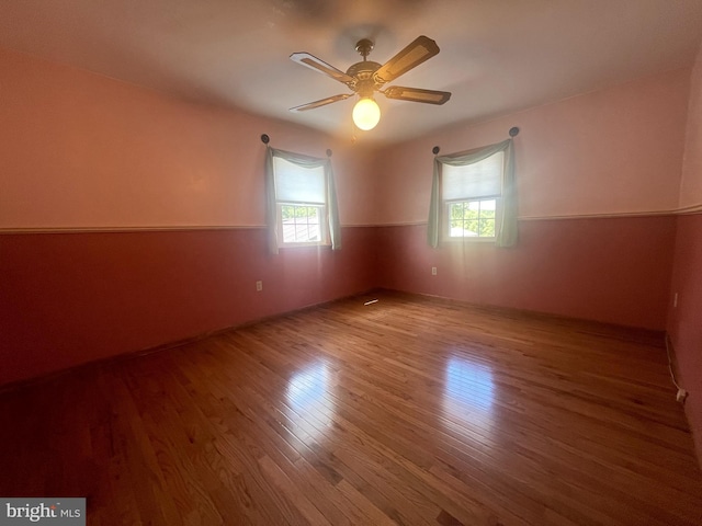 empty room featuring ceiling fan and wood-type flooring