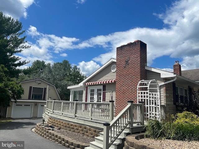 view of front facade featuring a garage and a deck