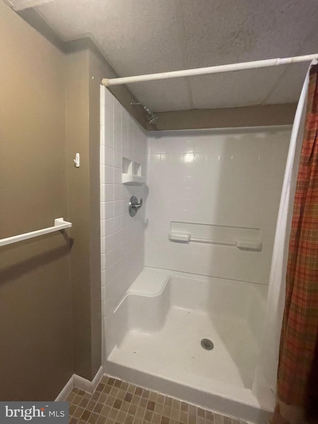 bathroom featuring tile patterned floors and a shower with shower curtain