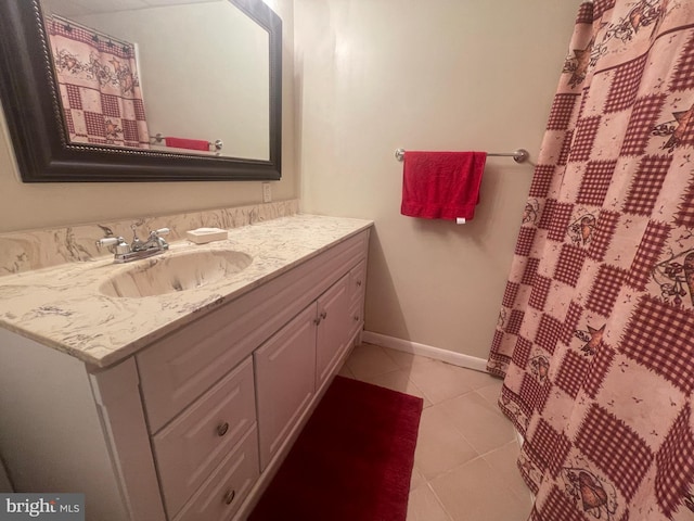 bathroom with tile patterned flooring and vanity