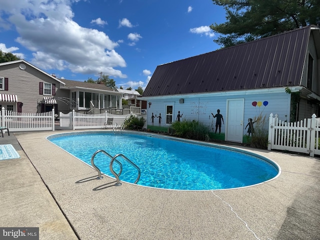 view of pool featuring a patio area