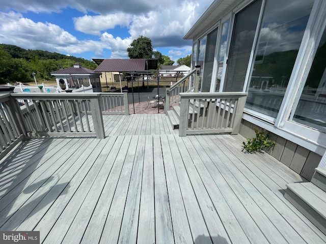 wooden deck featuring a gazebo