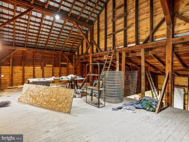 unfinished attic with an upstairs landing