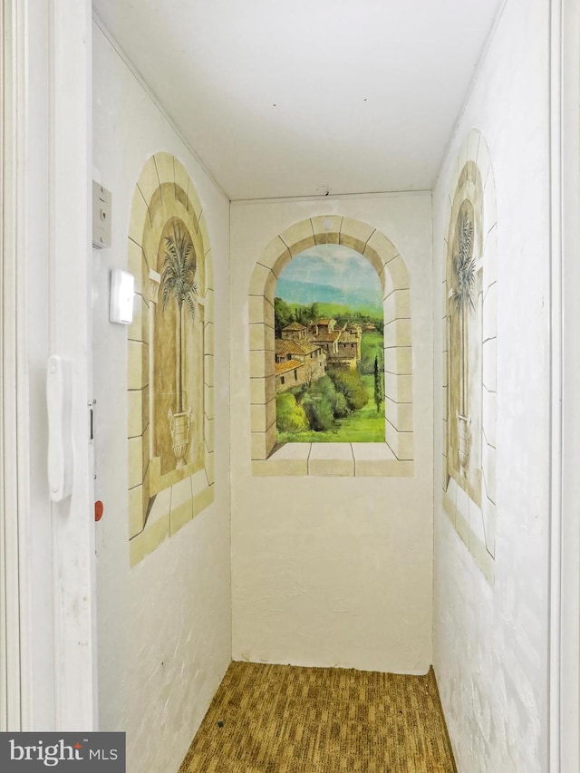 corridor featuring carpet flooring