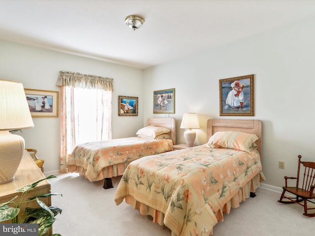 carpeted bedroom with baseboards