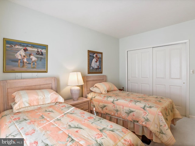carpeted bedroom featuring a closet