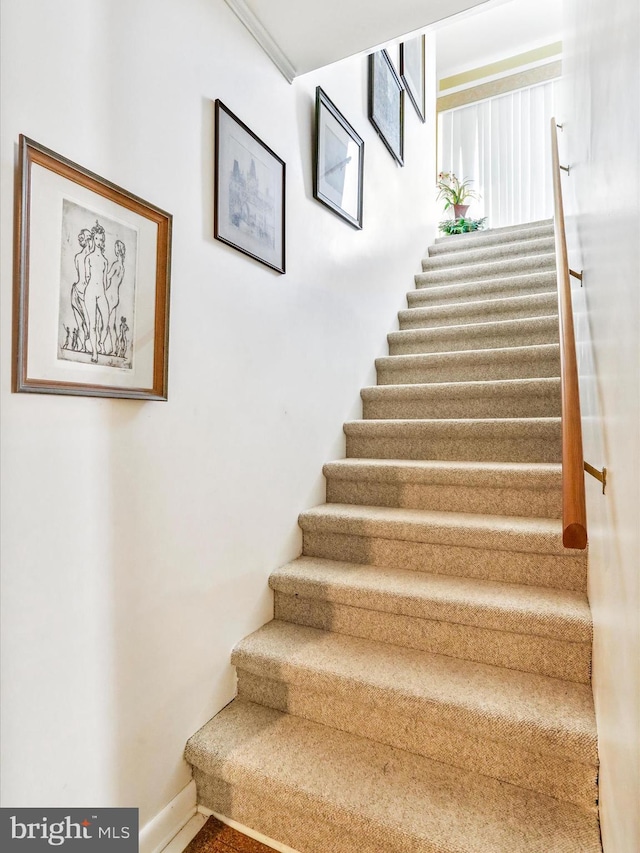 stairs featuring baseboards