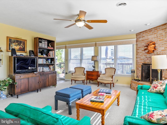 living room with baseboards, visible vents, a ceiling fan, and carpet floors