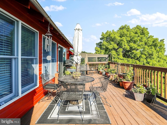 deck featuring outdoor dining space