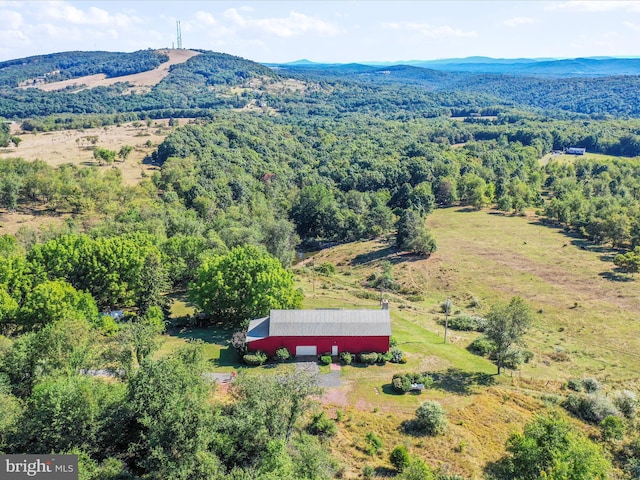 aerial view with a mountain view and a forest view