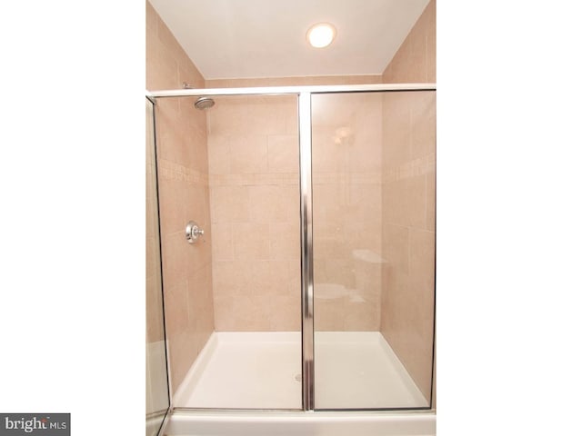 bathroom featuring an enclosed shower