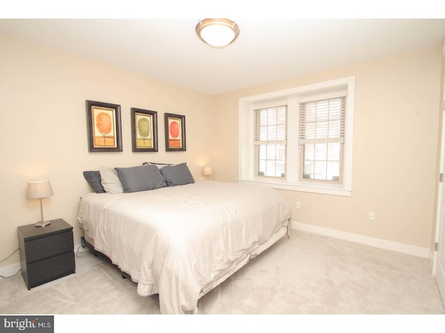 bedroom with light carpet