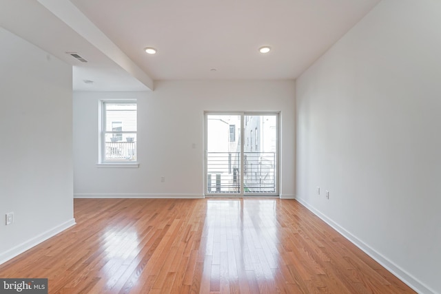 spare room with light hardwood / wood-style floors