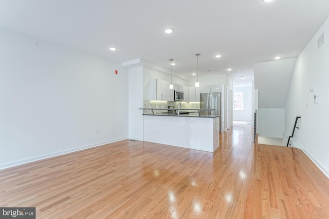 interior space featuring sink and light hardwood / wood-style floors