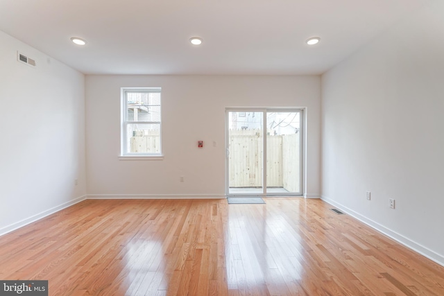 spare room with light wood-type flooring