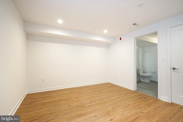 empty room with hardwood / wood-style floors