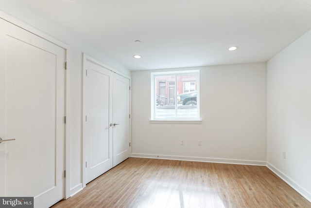 unfurnished bedroom with light wood-type flooring