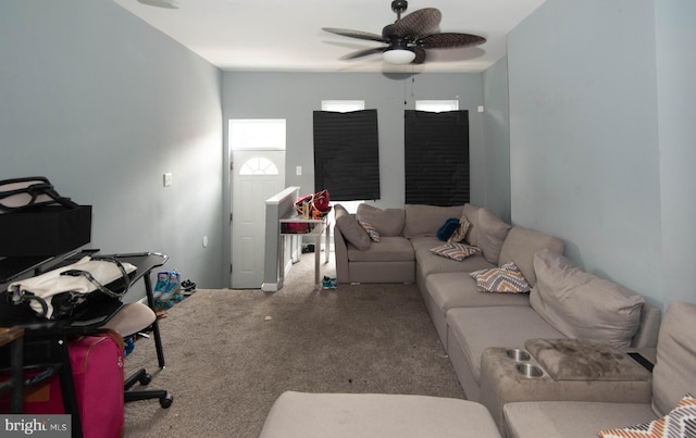 carpeted living room with ceiling fan